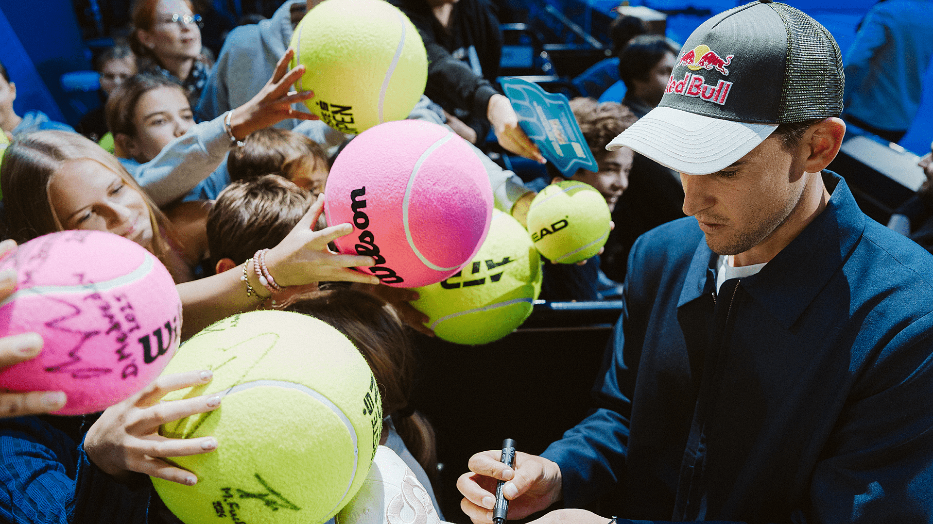 Dominic Thiem signing autographs at Super Fan Day